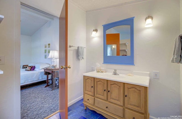 bathroom with vanity and a textured ceiling