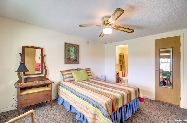 bedroom featuring ceiling fan, connected bathroom, dark carpet, and a textured ceiling