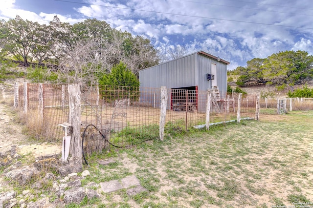 view of shed / structure featuring a lawn