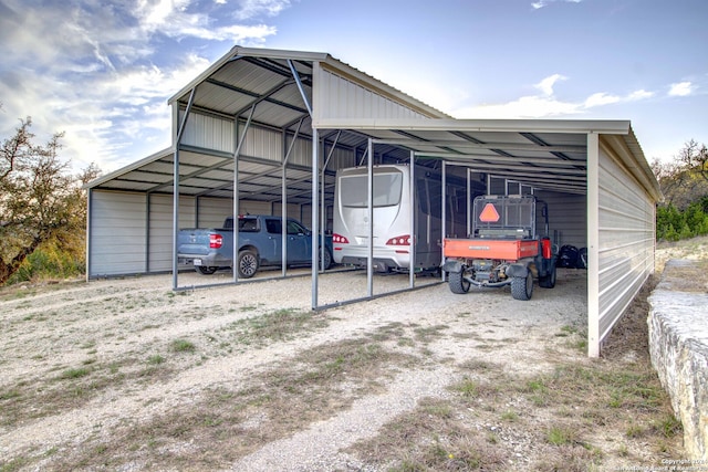 view of parking / parking lot with a carport