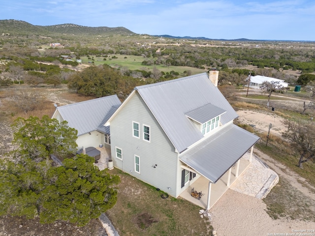 drone / aerial view featuring a mountain view