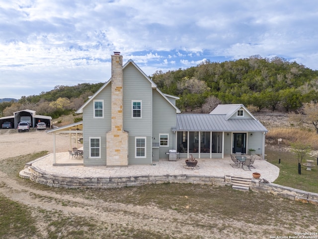 back of property with a patio area