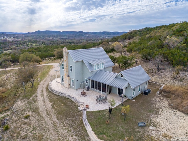 birds eye view of property with a mountain view