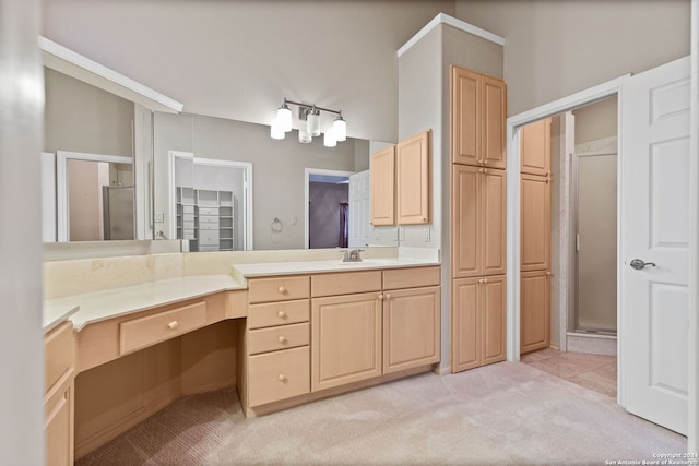 bathroom with tile floors, a shower with door, and vanity