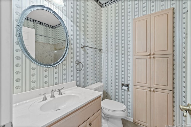 bathroom featuring toilet and vanity