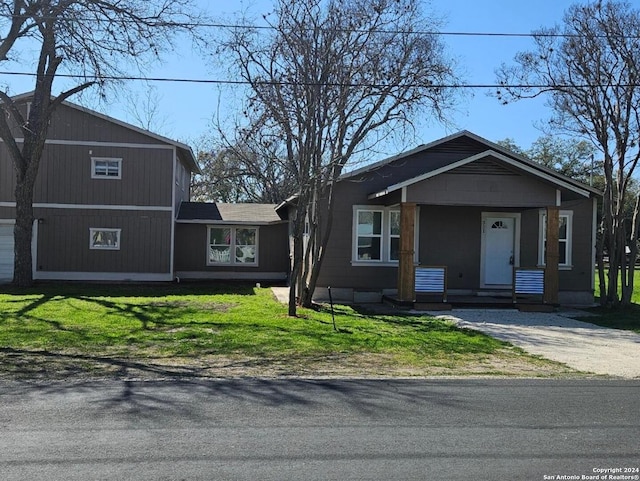 view of front of house featuring a front lawn and a porch