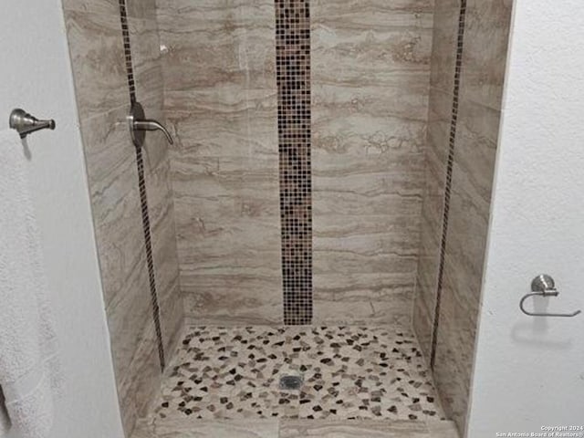 interior space with a tile shower