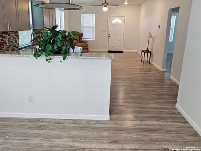 hall with light hardwood / wood-style floors