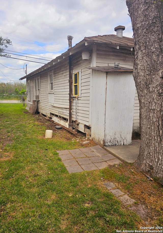 view of home's exterior with a lawn