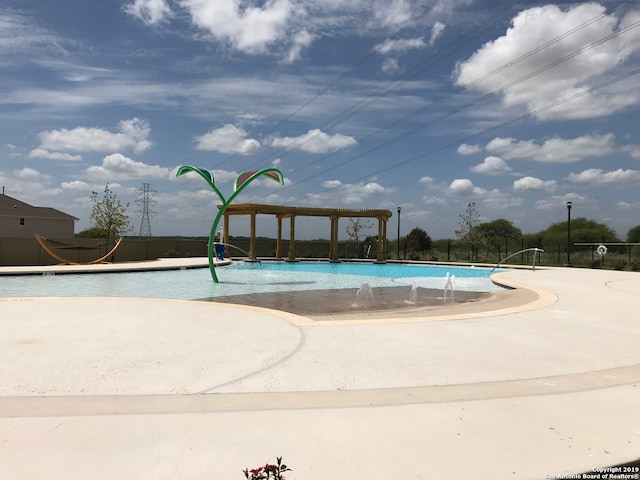 view of swimming pool featuring a patio area