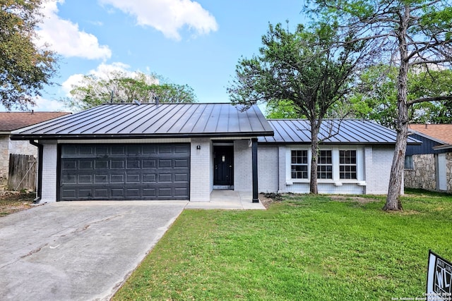 ranch-style home with a front lawn and a garage