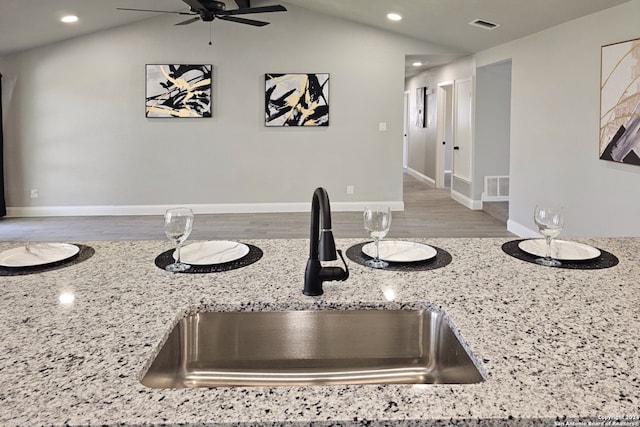 room details featuring ceiling fan, sink, and light wood-type flooring