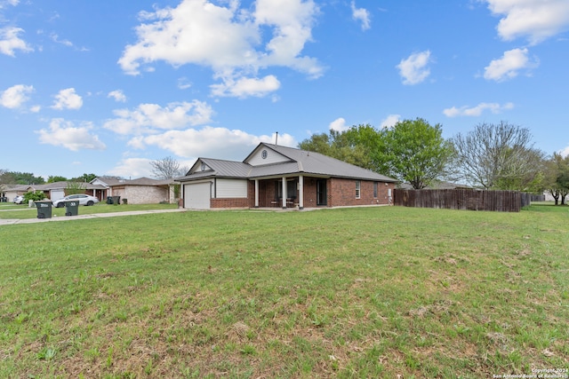 ranch-style house featuring a garage and a front lawn