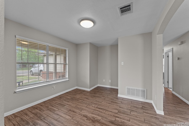 empty room with light hardwood / wood-style floors