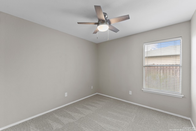 carpeted empty room with ceiling fan