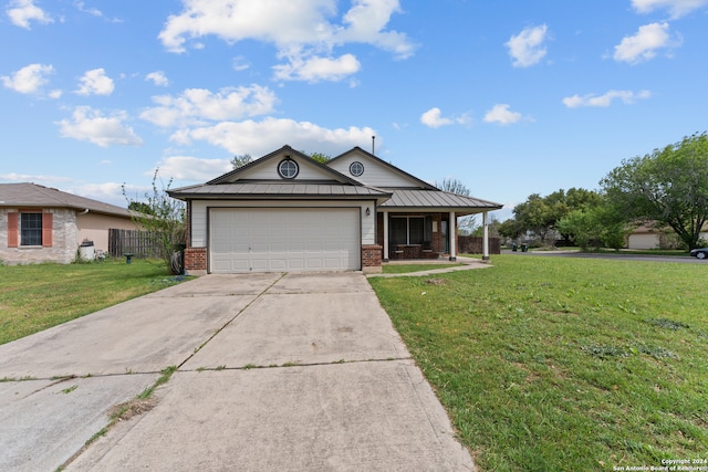 ranch-style house featuring a front lawn and a garage