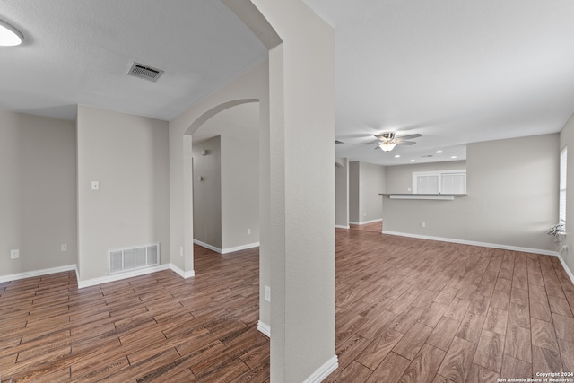 unfurnished room featuring hardwood / wood-style floors and ceiling fan