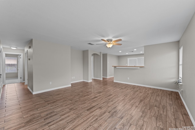 unfurnished room featuring ceiling fan and hardwood / wood-style floors