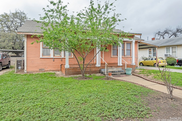 view of front of home with a front yard