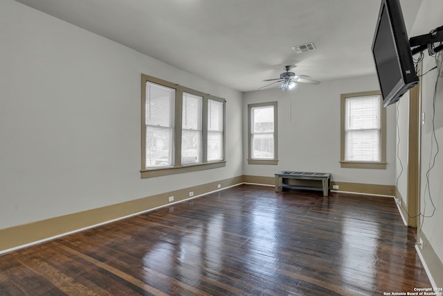 spare room featuring ceiling fan and dark hardwood / wood-style flooring