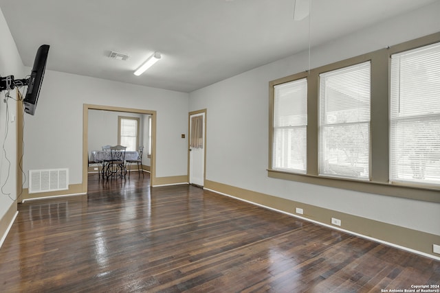 unfurnished room featuring dark hardwood / wood-style floors