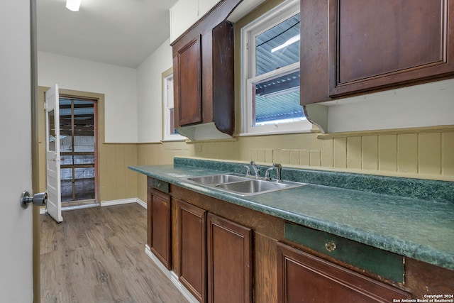 kitchen with sink and light hardwood / wood-style floors