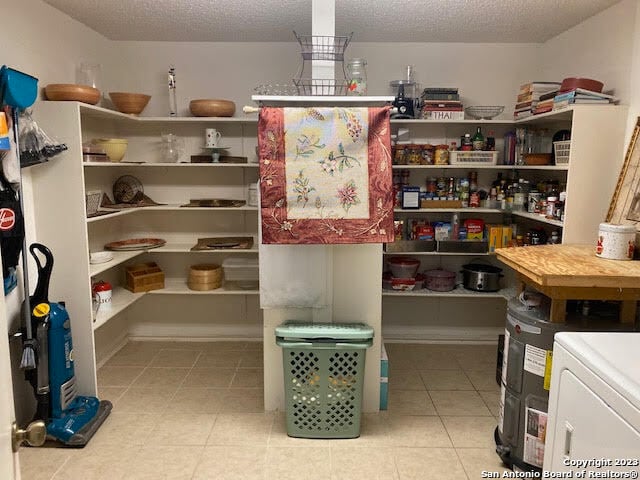 pantry featuring washer / clothes dryer