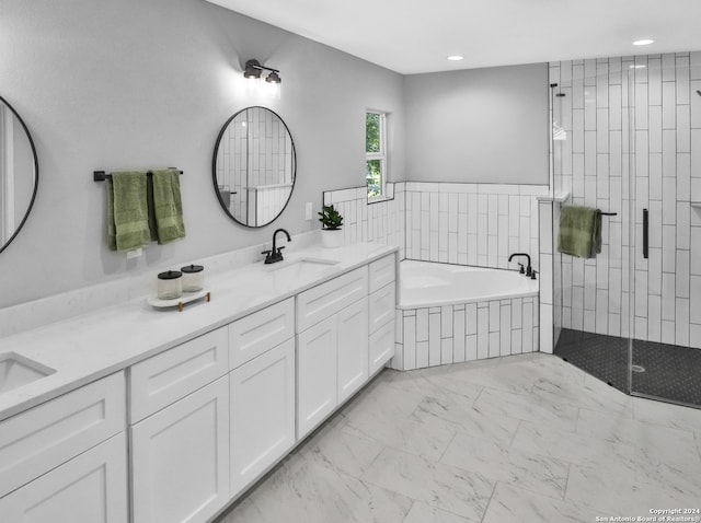 bathroom with shower with separate bathtub and vanity