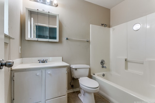 full bathroom with tile flooring, toilet, vanity, and shower / tub combination