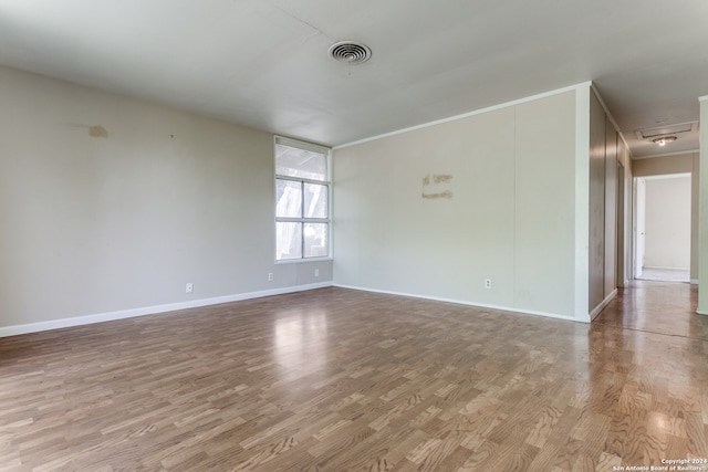 unfurnished room with light hardwood / wood-style flooring