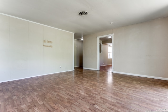 unfurnished room featuring hardwood / wood-style flooring