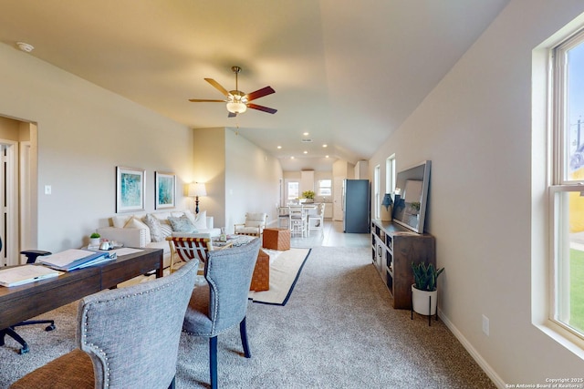 dining room with light carpet, plenty of natural light, and ceiling fan