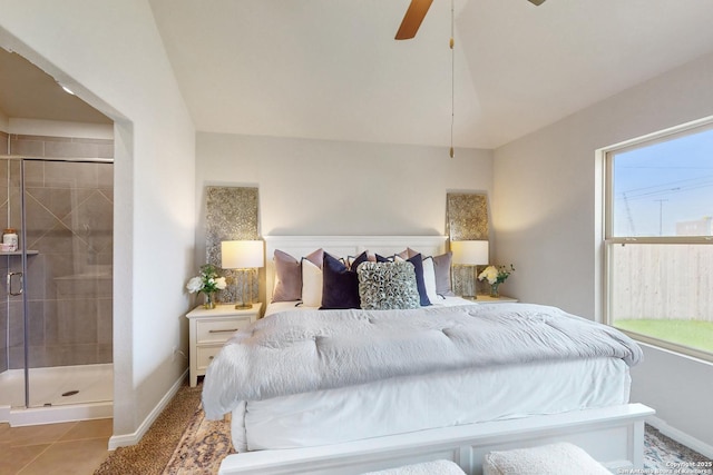 tiled bedroom featuring ceiling fan