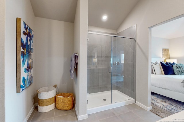 bathroom featuring tile patterned flooring, vaulted ceiling, and an enclosed shower