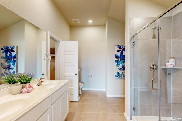 bathroom with toilet, vanity, an enclosed shower, and tile patterned flooring