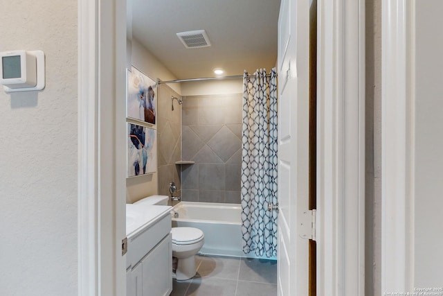 full bathroom featuring vanity, toilet, tile patterned floors, and shower / tub combo with curtain