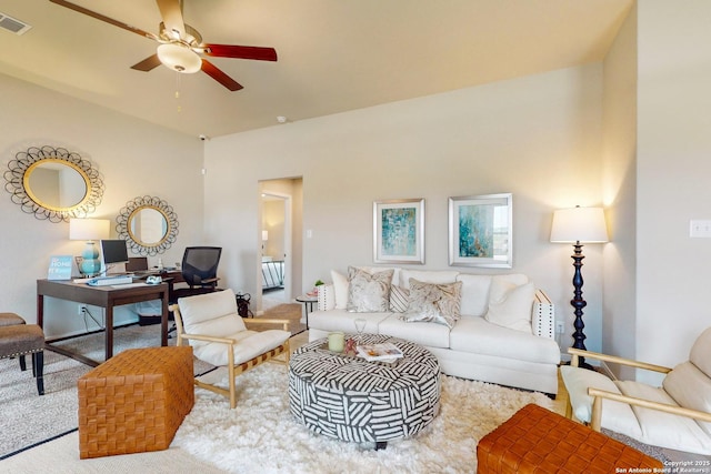 living room with carpet floors and ceiling fan