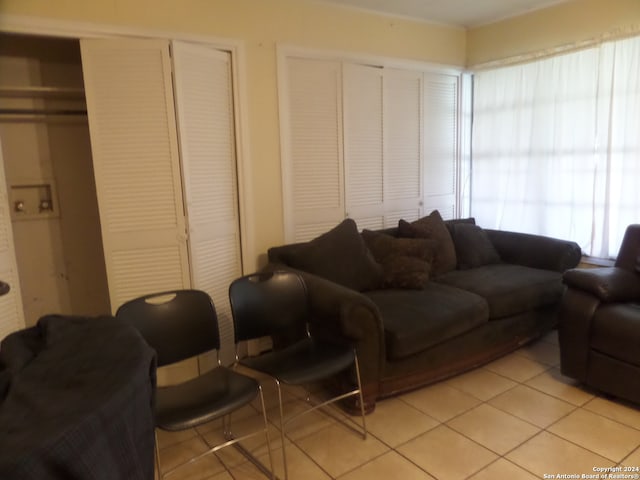 living room featuring light tile floors