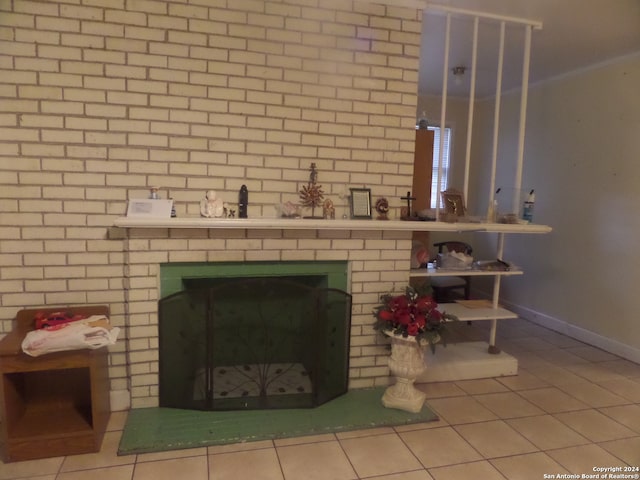 room details featuring light tile flooring and a fireplace