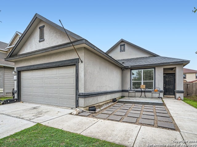 ranch-style house featuring a garage