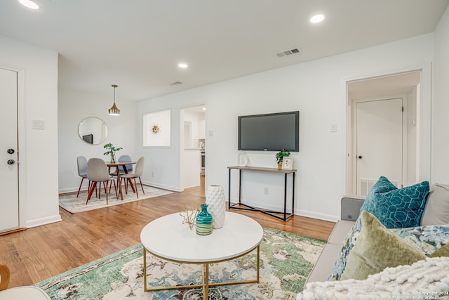 living room with light hardwood / wood-style flooring