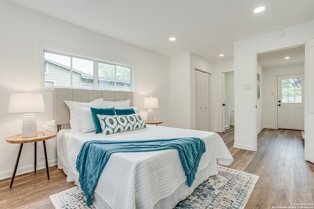 bedroom featuring a closet and light wood-type flooring