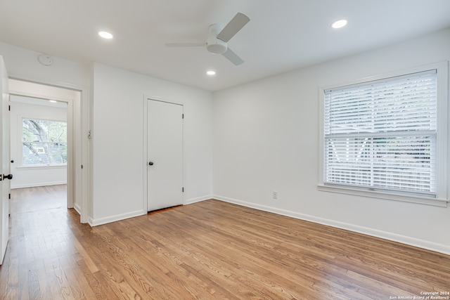 spare room featuring ceiling fan and light hardwood / wood-style flooring