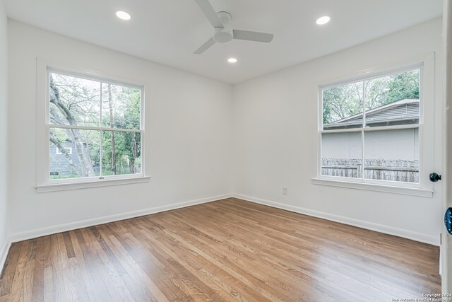 empty room featuring ceiling fan and light hardwood / wood-style flooring