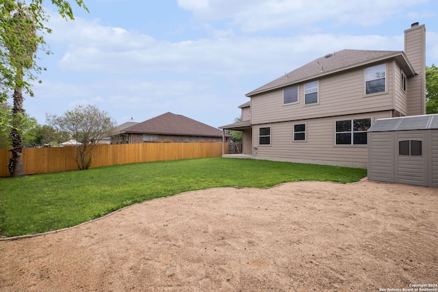 back of house with a yard