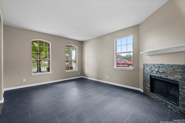 unfurnished living room with a fireplace