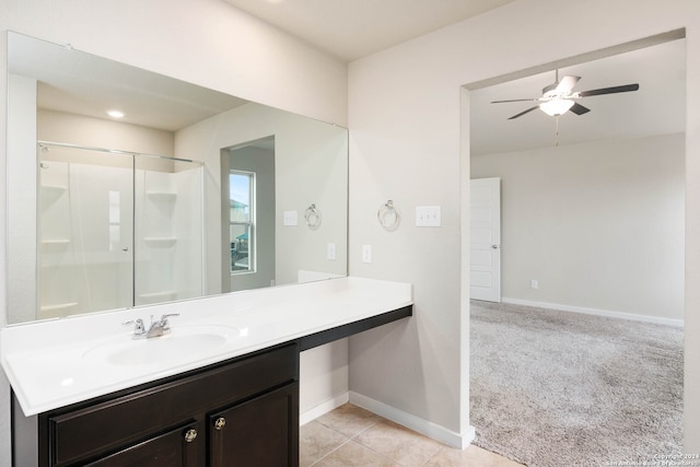 bathroom featuring vanity, tile flooring, a shower with shower door, and ceiling fan