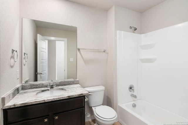 full bathroom with toilet, vanity, and tub / shower combination