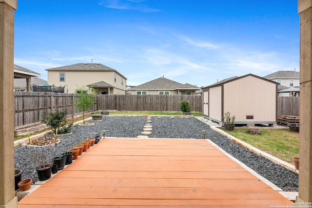 wooden terrace with a storage unit