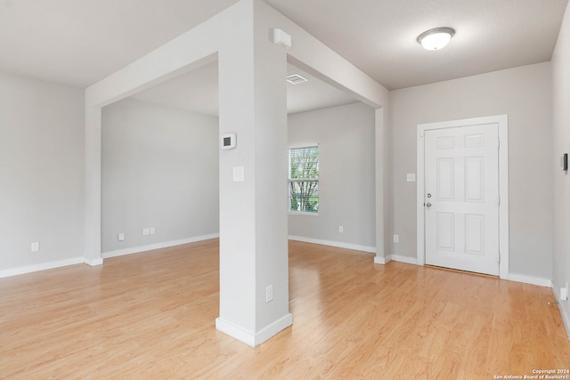 foyer entrance with light hardwood / wood-style flooring